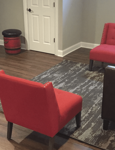 Area rug on wood-like floors in Wheaton, IL from Superb Carpets, Inc.