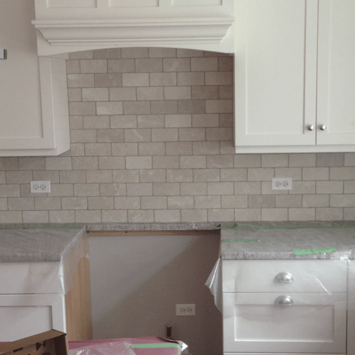 Tiled backsplash in the kitchen in  from Superb Carpets, Inc.