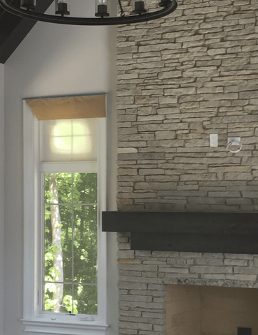Stone fireplace in a remodeled room in Wheaton, IL from Superb Carpets, Inc.