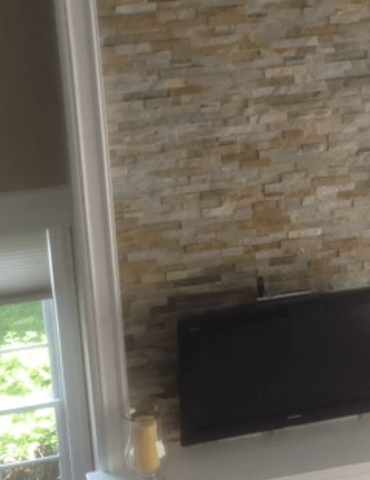 Stone wall TV mount in Carol Stream, IL from Superb Carpets, Inc.