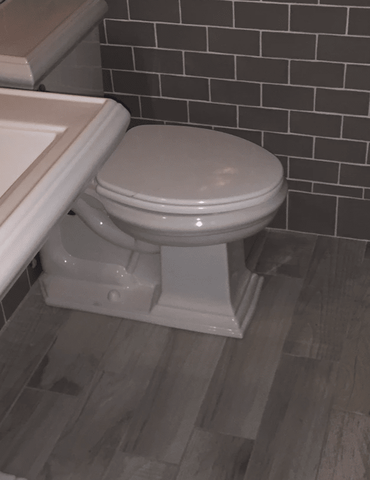 Remodeled bathroom with tile flooring and vinyl flooring in Carol Stream, IL from Superb Carpets, Inc.