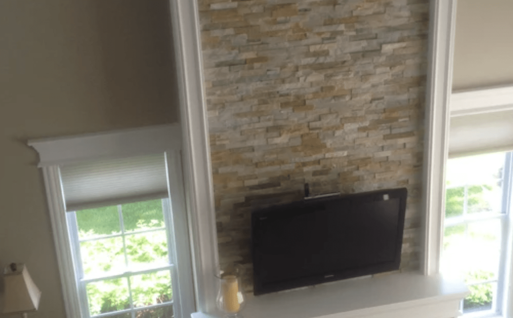 Stone wall TV mount in Carol Stream, IL from Superb Carpets, Inc.