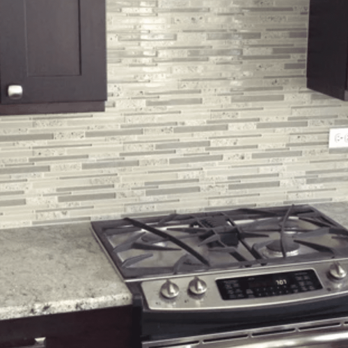 Tile backsplash and beautiful countertops in Wheaton, IL from Superb Carpets, Inc.